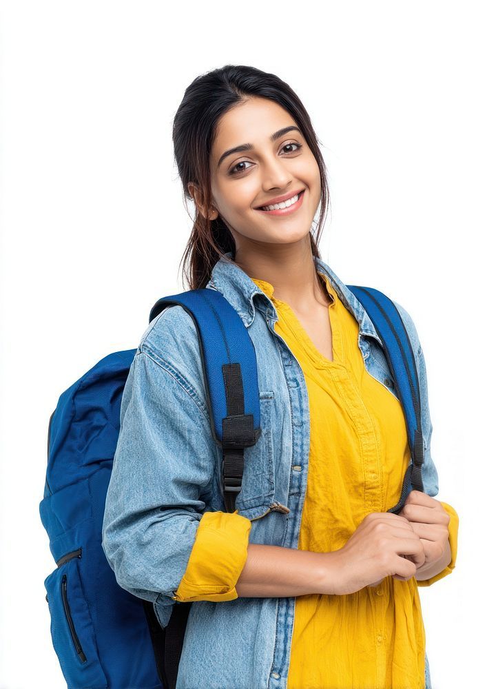 smiling female university student with backpack wearing yellow top and denim jacket isolated on white background